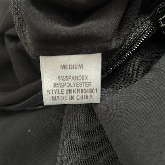 Black pleated front romper with lace trim sleeves and neck line - Picture 10 of 10